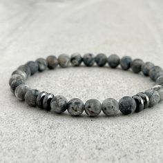 Refund Policy: Items can be returned for refund (less shipping costs) within 14-days.  All items must be in new/unworn condition.  If items are not returned in new/unworn condition, they will be sent back at buyer's expense.Men's beaded bracelet made with strong, stretchy cord and genuine/natural gemstones. Features ~ 6mm or 8mm matte black labradorite beads.  Choose your bead size ~ 6mm or 8mm black hematite rondelle beads ~ Non-fraying stretchy cord; simply slide bracelet on and off wrist ~ Co Adjustable Gray Beaded Bracelets With 8mm Beads, Adjustable Gray Stretch Bracelet With Round Beads, Adjustable Gray 8mm Beads Bracelets, Casual Gray Bracelet With Round Beads, Adjustable Gray Gemstone Beads Bracelets, Adjustable Gray Gemstone Beads Bracelet, Hematite Crystal, Black Labradorite, Slide Bracelet