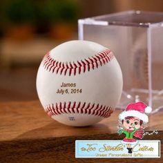 a baseball with a santa hat on it next to a clear box