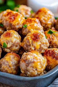 meatballs with cheese and parsley in a bowl