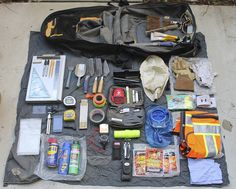 the contents of a backpack laid out on a tarp