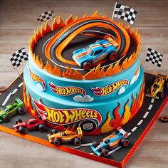 a birthday cake made to look like a hot wheels race track with cars on it