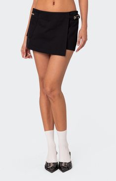 Online Only! Introducing the Utility Micro Wrap Skort from Edikted, your new summer staple for both style and practicality! Crafted from soft cotton, this low-rise micro skort features a chic wrap design with utility-style detailing. Perfect for adding a touch of versatility to your wardrobe, whether you're exploring the city streets or enjoying a day out with friends.


	Micro skort
	Wrap design
	Utility style detailing
	100% Cotton
	Model wears size S
	Model height is 5'9
	Item care: Wash with similar color Slim Fit Cargo Pants, Wrap Skort, Utility Style, Curve Jeans, Swimwear Dress, Jeans Kids, Kids Swimwear, Slim Fit Pants, Skirted Swimwear