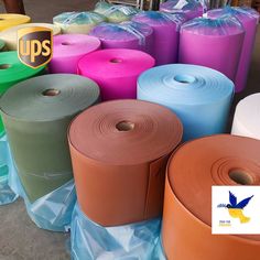 several rolls of colored toilet paper on the ground