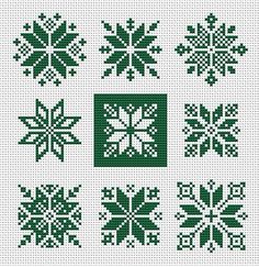 cross stitched snowflakes in green and white