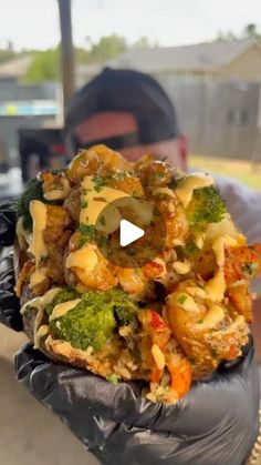 a man holding a bag full of food in his hand with the video showing it