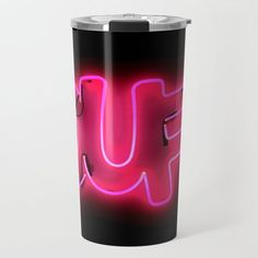 a neon pink u sign on a black background