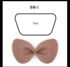 an image of a pink bow tie on a white background with the measurements for it