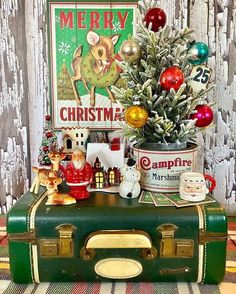 an old suitcase with christmas decorations on it