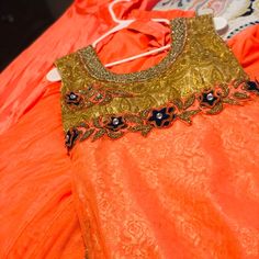 Its A Peach Color Suit With Nice Details And Has Gotta Paati With Embroidered Neck Both Front And Back. It Has A Shaara And Also A Pajami With It. It Has Nice Details With Gold Stones And Also Some Net Details. It Looms Absolutely Beautiful On. I Have Wore It Only 4 Times. Sleeveless Orange Set For Festive Occasion, Festive Orange Sleeveless Sets, Orange Sleeveless Festive Set, Festive Orange Embellished Sets, Elegant Orange Choli For Festive Season, Elegant Orange Choli For Festive Occasions, Elegant Festive Orange Choli, Elegant Orange Festive Choli, Festive Orange Sets With Dabka Work