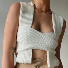 Elevate your wardrobe with our Sahara Multiway Bandage Knit Tank Top. Made with premium materials, this top offers versatile styling options with its multiway wrap design. Its bandage knit provides a flattering, body-hugging fit that accentuates your curves. Be creative! One Size: Bust:70-95cm / 27.6 -37.4"; Length: 40cm / 15.75" Gender: WOMEN Item Type: Tops, Knitwear Material: COTTON/Polyester Clothing Length: Short Fabric Type: Woven Material: POLYESTER Collar: Square Collar, Turtleneck Closu Crop Pullover, White Jumper, Cropped Pullover, Sweater Vest Women, Knit Wrap, Casual Vest, Cropped Tops, Vest Fashion, Sleeveless Crop Top