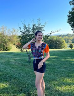 Gorgeous 100% hand-stitched bright orange and colorful front top. This bright top reminds us of beautiful Blagaj, Bosnia and Herzegovina. The bright orange stands out like the warm sun does on the beautiful water & the colors all combine and remind us of the water flowing and all the beautiful traditional aspects. Made from the embroidery of traditional womens dresses and customized into a beautiful and chic boho top. Short sleeve bright orange embroider tank top with open lace back. All 100% hand-made and hand stitched. Pretty orange top with multi color embroidery front. Light weight compared to other embroidery. Adjustable back with strings and gorgeous colored stitching. With adjustable back, it can easily fit in sizes small to a medium Blagaj Bosnia, Pretty Orange, Roanoke Va, Color Embroidery, Sparkly Top, Beautiful Water, Stitch Shirt, Wedding Top, Orange Top