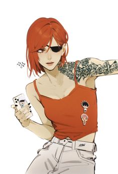 a woman with red hair and tattoos on her arm holding two cards in one hand