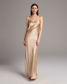 Named by Vogue as a must-have, this easy to wear luxury charmeuse slip dress is the perfect day to night staple. Featuring a bias cut and the finest silk quality, it shapes flatteringly to every type of body. Bias cut silk charmeuse slip elegantly drapes on the body. 100% Silk Charmeuse Made in New York City Model is wearing a size S and is 5'10" Product Care: Dry Clean Only Suri Alpaca, City Model, Convertible Dress, Midi Slip Dress, Knit Alpaca, Long Gloves, The Perfect Day, Silk Slip Dress, Silk Tank