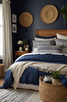 a bedroom with blue walls and white bedding, baskets on the wall above the bed