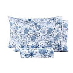 three pillows with blue flowers on them