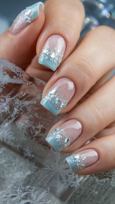 35 Stunning Blue Nail Art Designs to Inspire Your Next Manicure Ice Inspired Nails, Frosted Nail Designs, Icy Blue Nails Acrylic, Blue Glitter French Tip Nails, Blue Glitter Nail Designs, Frozen Inspired Nails, Frozen Nail Designs, Ombre Blue Nails, Ice Nails