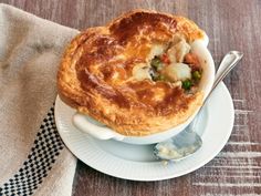 a pot pie sitting on top of a white plate