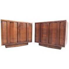 a pair of wooden cabinets sitting next to each other