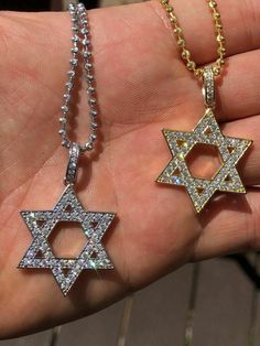 Gorgeous Star of David pendant!
SUPER ICY!
Solid 925 sterling silver
We have 2 styles! Rhodium finished & 14k yellow gold finished!
Measures roughly 1" by 1" (1.25" w. bale)...weighs roughly 5 grams
70 micropaved handset man made diamonds (CZ) for a total of 0.7ct!
SO ICY IT WILL BLIND YOU!
 
100% 925 silver...not plated or filled...will NEVER TARNISH OR CHANGE COLOR
You can buy pendant only or with choice of 18-30" 2.5mm diamond cut ball moon chains
Chains are also solid ster Silver Star Of David Charm Jewelry, Silver Star Of David Necklace In 14k Gold, 14k Gold Silver Star Of David Necklace, White Star Of David Jewelry For Anniversary, Silver Star Of David Pendant In 14k Gold, Silver Star Of David Jewelry In 14k Gold, Silver Star Of David 14k Gold Jewelry, 14k Gold Star Of David Jewelry, Silver Cubic Zirconia Star Of David Jewelry