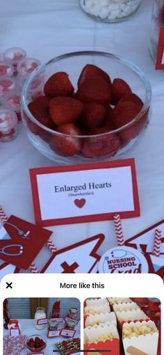 a table topped with lots of desserts covered in red and white frosted strawberries