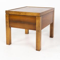 a small wooden table sitting on top of a white floor