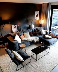 a living room filled with furniture next to a large glass wall window and a rug on the floor