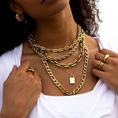 A trendy chunky link chain to elevate your stack. Chunky Link Necklace Length: 17" plus a 2" extension chain attached Width: 11mm Material: Stainless Steel Plating: 18k real gold Necklace is 100% nickel-free and cadmium-free Necklace is hypoallergenic and tarnish resistant Alpha Bracelet, Real Gold Necklace, Figaro Necklace, Jewel Necklace, Small Boutique, Necklace Chain Lengths, Jewelry Studio, Earring Sale, Boutique Jewelry