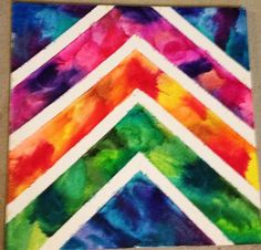 an art project made with watercolors on paper and colored strips in different colors