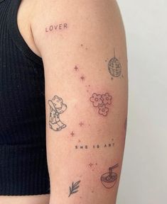 a woman's arm with tattoos on it and the words lover written in different languages