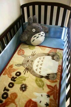 a stuffed animal sitting on top of a baby crib