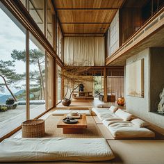 a living room with lots of furniture and large windows