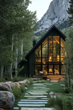 a house that is surrounded by trees and rocks