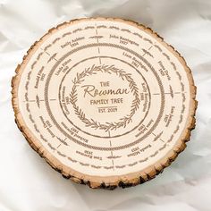 a tree slice with the name and family tree engraved on it's center piece