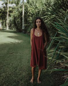 This item is final sale. A staple summer dress is crafted from breezy handwoven cotton fabric, cut for a relaxed fit and an A-line silhouette. The wide shoulder straps, deep pockets, scoop neckline and flowy fit are finishing touches to this sustainable dress. - Length: 36” - Fabric: Handwoven cotton - Color: Umber/brown Flowy Maxi Dress With Pockets For Summer, Flowy Summer Maxi Dress With Pockets, Breezy Summer Loungewear Dresses, Summer Breezy Loungewear Dresses, Summer Cotton Sleeveless Dress With Adjustable Straps, Flowy Casual Sundress For Loungewear, Scoop Neck Summer Dress For Vacation, Summer Scoop Neck Dresses For Vacation, Summer Scoop Neck Vacation Dresses