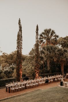 an outdoor wedding setup with tables and chairs