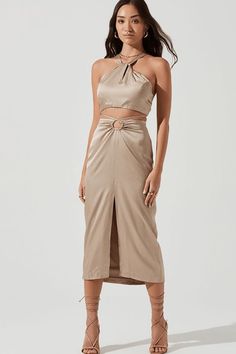 This item is Final Sale.  Everyone needs the Robin Cutout Midi Skirt in Blue in their wardrobe. Featuring a luxurious silk fabric and midi-length, it is classic and elegant on the surface. Yet, the trendy keyhole cutout and strappy hip detailing, add a stylish edge to the piece. Pair with the matching Robin Halter Crop Top for the perfect sophisticated and trendy event look.  Composition & Fit High Waist Detail Small Front Cut Out Smooth Satin Material  Midi Length Satin Crop Top, Striped Midi Skirt, Astr The Label, Satin Color, Halter Crop Top, Satin Skirt, Satin Material, Women Skirts Midi, Tie Back