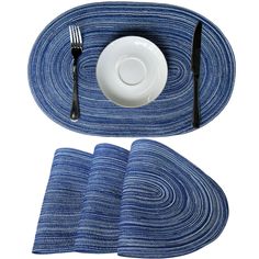 a place setting with blue and white striped napkins, silverware and a plate