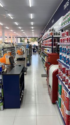 an aisle in a store filled with lots of items