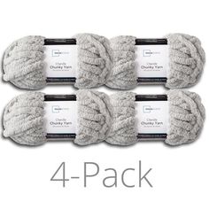 four balls of chunk yarn in grey and white, with the text 4 - pack