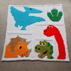 a cross stitch pattern with dinosaurs and dinos on the front, in different colors