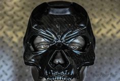 a close up of a black mask on a mannequin head