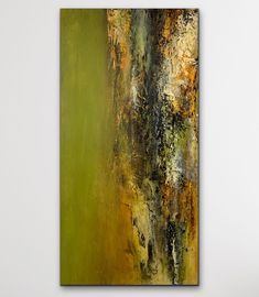 an abstract painting on the wall in a room with white walls and green flooring