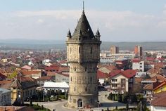 an old clock tower in the middle of town