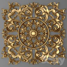 an intricate golden pattern on a gray background