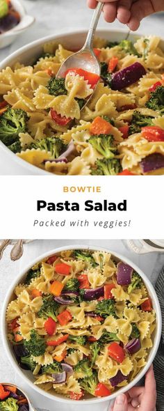 pasta salad in a white bowl with broccoli and carrots