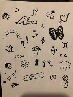 a sheet of paper with drawings on it and symbols drawn in the shape of animals