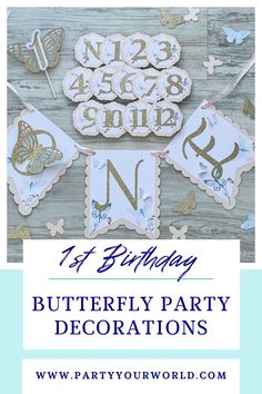 a blue and white birthday party with butterfly decorations