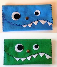 two felt monster wallets with googly eyes and mouthy mouths, one is green and the other is blue