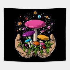 two hands holding colorful mushrooms in the middle of a black background with stars and planets