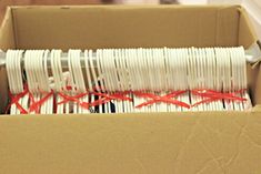 a box filled with lots of white and red wires